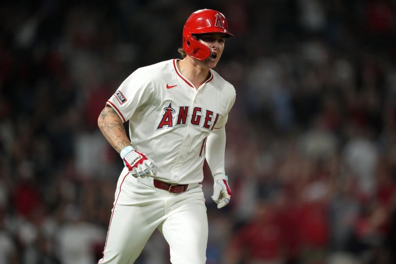 Aug 31, 2024; Anaheim, California, USA; Los Angeles Angels center fielder Mickey Moniak (16) celebrates after hitting a walk-off home run in the ninth inning against the Seattle Mariners at Angel Stadium. Mandatory Credit: Kirby Lee-USA TODAY Sports