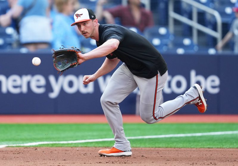 Jun 3, 2024; Toronto, Ontario, CAN; Baltimore Orioles third baseman Jordan Westburg (11) fields balls during batting practice before a game against the Toronto Blue Jays at Rogers Centre. Mandatory Credit: Nick Turchiaro-USA TODAY Sports