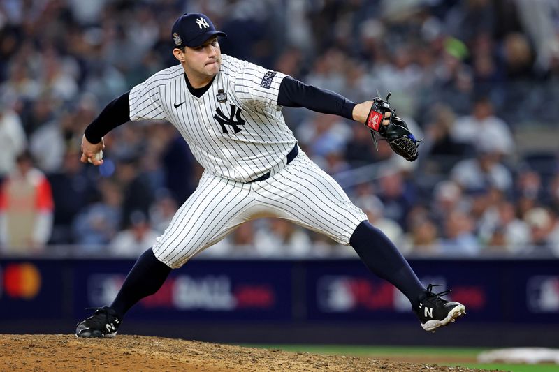 Oct 30, 2024; New York, New York, USA; New York Yankees pitcher Tommy Kahnle (41) pitches during the eighth inning against the Los Angeles Dodgers in game four of the 2024 MLB World Series at Yankee Stadium. Mandatory Credit: Brad Penner-Imagn Images