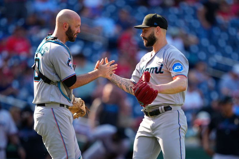 Sep 3, 2023; Washington, District of Columbia, USA;  Miami Marlins catcher Jacob Stallings (58) and pitcher Tanner Scott (66) celebrate the victory after the game against the Washington Nationals at Nationals Park. Mandatory Credit: Gregory Fisher-USA TODAY Sports