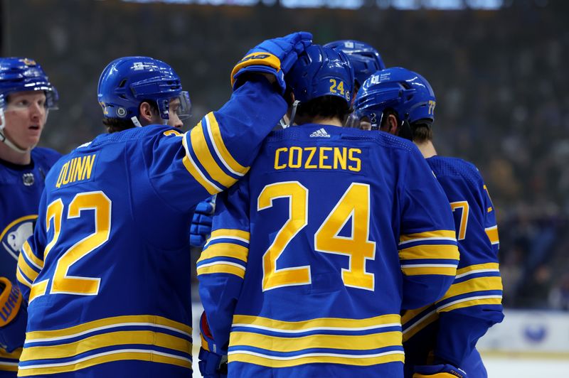 Jan 20, 2024; Buffalo, New York, USA;  Buffalo Sabres center Dylan Cozens (24) celebrates his goal with teammates during the second period against the Tampa Bay Lightning at KeyBank Center. Mandatory Credit: Timothy T. Ludwig-USA TODAY Sports