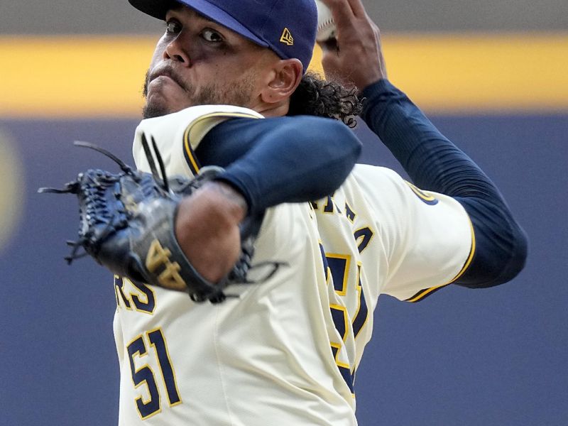 Jun 24, 2024; Milwaukee, Wisconsin, USA; Milwaukee Brewers pitcher Freddy Peralta (51) throws during the first inning of their game against the Texas Rangers at American Family Field. Mandatory Credit: Mark Hoffman/INDIANAPOLIS STAR-USA TODAY Sports