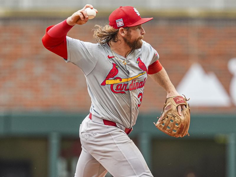 Jul 20, 2024; Cumberland, GA, USA; St. Louis Cardinals left fielder Brendan Donovan (33) throws out Atlanta Braves right fielder Adam Duvall (14) (not shown) during the second inning at Truist Park. Mandatory Credit: Dale Zanine-USA TODAY Sports