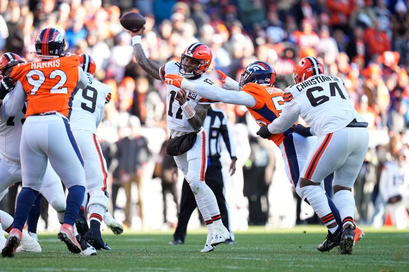 Cleveland Browns quarterback Dorian Thompson-Robinson (17) throws under pressure from Denver Broncos linebacker Barron Browning as Browns offensive tackle Geron Christian (64) defends during the first half of an NFL football game on Sunday, Nov. 26, 2023, in Denver. (AP Photo/Jack Dempsey)