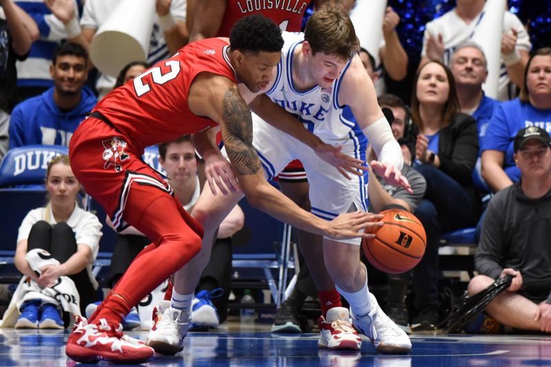 Feb 20, 2023; Durham, North Carolina, USA; Louisville Cardinals forward JJ Traynor (12) and Duke Blue Devils center Kyle Filipowski(30) battle for a loose ball during the first half at Cameron Indoor Stadium. Mandatory Credit: Rob Kinnan-USA TODAY Sports