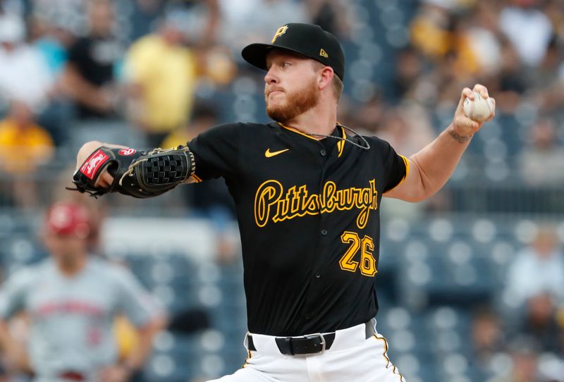 Jun 18, 2024; Pittsburgh, Pennsylvania, USA;  Pittsburgh Pirates starting pitcher Bailey Falter (26) delivers  pitch against the Cincinnati Reds during the first inning at PNC Park. Mandatory Credit: Charles LeClaire-USA TODAY Sports