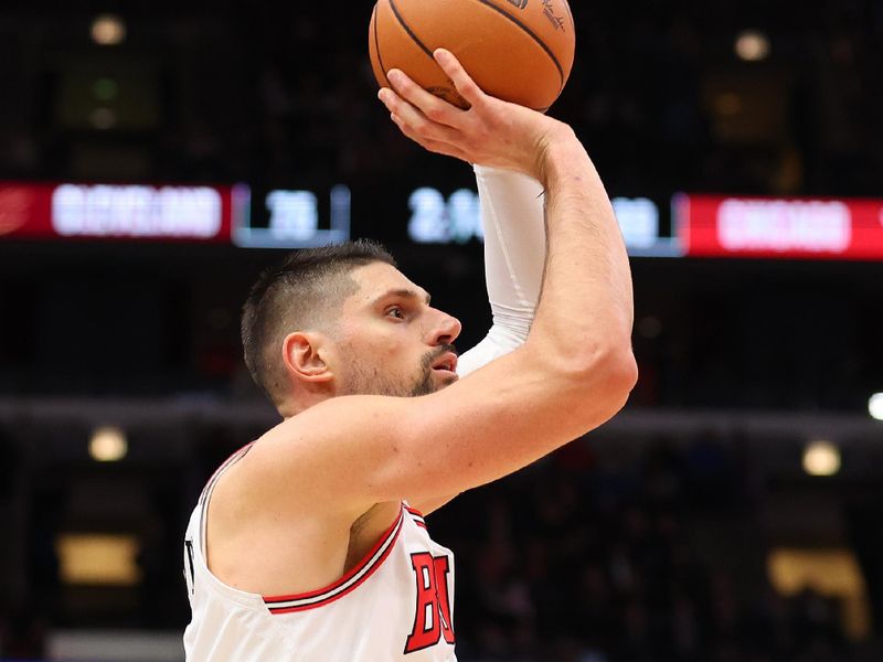 CHICAGO, ILLINOIS - DECEMBER 23: Nikola Vucevic #9 of the Chicago Bulls shoots a jumper against the Cleveland Cavaliers during the second half at the United Center on December 23, 2023 in Chicago, Illinois. NOTE TO USER: User expressly acknowledges and agrees that, by downloading and or using this photograph, User is consenting to the terms and conditions of the Getty Images License Agreement.  (Photo by Michael Reaves/Getty Images)