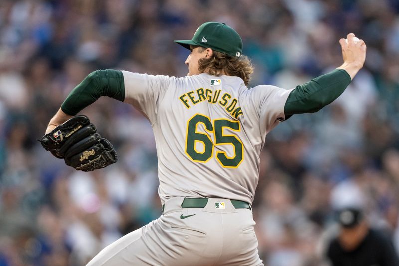 May 10, 2024; Seattle, Washington, USA; Oakland Athletics reliever Tyler Ferguson (65) delivers a pitch during the fifth inning against the Seattle Mariners at T-Mobile Park. Mandatory Credit: Stephen Brashear-USA TODAY Sports