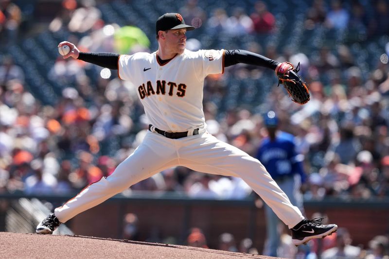 Apr 9, 2023; San Francisco, California, USA; San Francisco Giants starting pitcher Anthony DeSclafani (26) throws a pitch against the Kansas City Royals during the first inning at Oracle Park. Mandatory Credit: Darren Yamashita-USA TODAY Sports