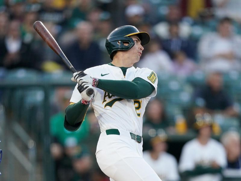Apr 23, 2025; West Sacramento, California, USA; Athletics left fielder Tyler Soderstrom (21) hits a double against the Texas Rangers in the first inning at Sutter Health Park. Mandatory Credit: Cary Edmondson-Imagn Images