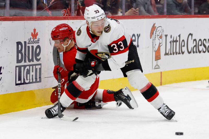 Jan 7, 2025; Detroit, Michigan, USA; Detroit Red Wings right wing Jonatan Berggren (48) and Ottawa Senators defenseman Nikolas Matinpalo (33) battle for the puck in the second period at Little Caesars Arena. Mandatory Credit: Rick Osentoski-Imagn Images