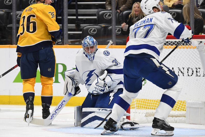 Dec 3, 2023; Nashville, Tennessee, USA; Tampa Bay Lightning goaltender Jonas Johansson (31) makes a save during the first period against the Nashville Predators at Bridgestone Arena. Mandatory Credit: Christopher Hanewinckel-USA TODAY Sports