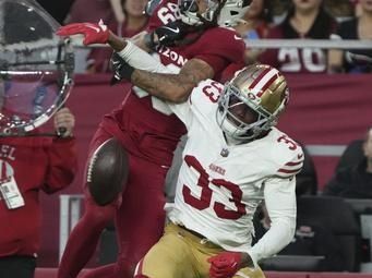 San Francisco 49ers cornerback Rock Ya-Sin (33) knocks the ball from Arizona Cardinals wide receiver Xavier Weaver (89) during the second half of an NFL football game in Glendale, Ariz., Sunday, Jan. 5, 2025. (AP Photo/Rick Scuteri)