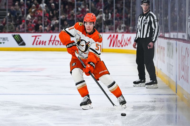 Mar 15, 2026; Montreal, Quebec, CAN; Anaheim Ducks defenseman Olen Zellweger (51) plays the puck against the Montreal Canadiens during the second period at Bell Centre. Mandatory Credit: David Kirouac-Imagn Images