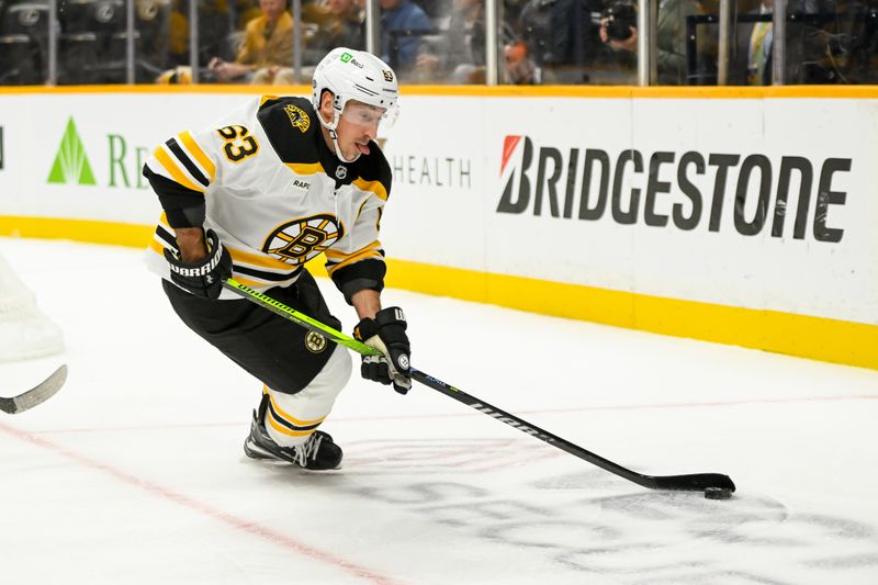 Oct 22, 2024; Nashville, Tennessee, USA; Boston Bruins left wing Brad Marchand (63) skates with the puck against against the Nashville Predators during the second period at Bridgestone Arena. Mandatory Credit: Steve Roberts-Imagn Images