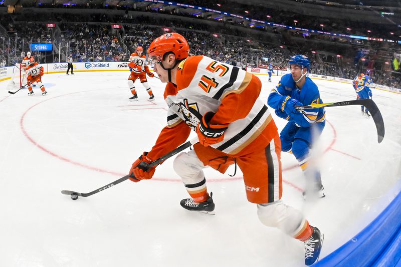 Dec 1, 2025; St. Louis, Missouri, USA; Anaheim Ducks right wing Beckett Sennecke (45) controls the puck as St. Louis Blues defenseman Matthew Kessel (51) defends during the second period at Enterprise Center. Mandatory Credit: Jeff Curry-Imagn Images