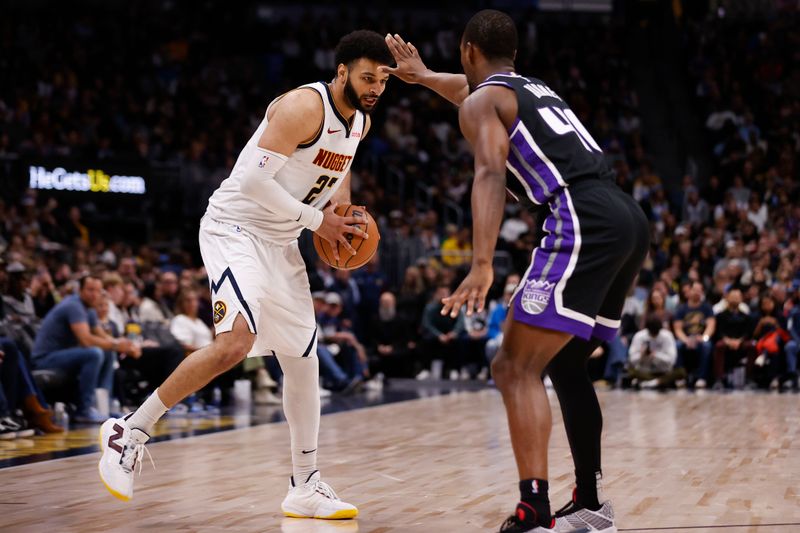 DENVER, COLORADO - FEBRUARY 28: Jamal Murray #27 of the Denver Nuggets looks to pass against Harrison Barnes #40 of the Sacramento Kings at Ball Arena on February 28, 2024 in Denver, Colorado. NOTE TO USER: User expressly acknowledges and agrees that, by downloading and or using this photograph, User is consenting to the terms and conditions of the Getty Images License Agreement. (Photo by Brendall O'Banon/Clarkson Creative/Getty Images)