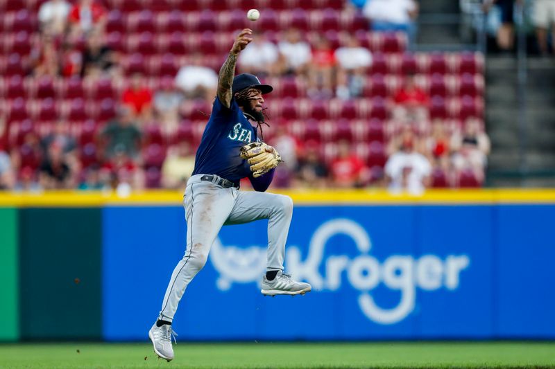 Sep 5, 2023; Cincinnati, Ohio, USA; Seattle Mariners shortstop J.P. Crawford (3) throws to first in attempt to get Cincinnati Reds third baseman Noelvi Marte (not pictured) out in the third inning at Great American Ball Park. Mandatory Credit: Katie Stratman-USA TODAY Sports