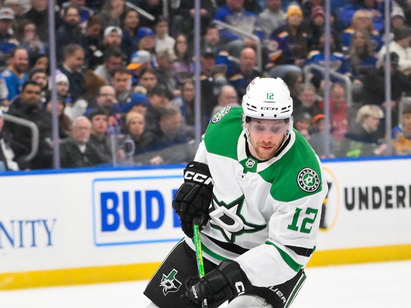 Jan 27, 2026; St. Louis, Missouri, USA; Dallas Stars center Radek Faksa (12) controls the puck against the St. Louis Blues during the first period at Enterprise Center. Mandatory Credit: Jeff Curry-Imagn Images