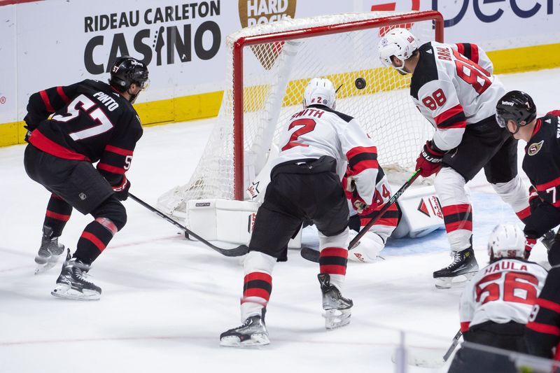 Apr 6, 2024; Ottawa, Ontario, CAN; Ottawa Senators center Shane Pinto (57) shoots wide of the goal in the third period against the New Jersey Devils at the Canadian Tire Centre. Mandatory Credit: Marc DesRosiers-USA TODAY Sports