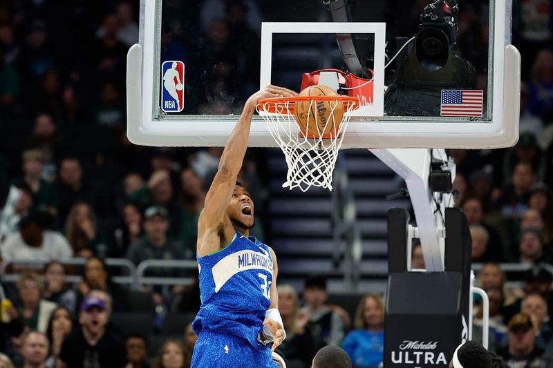 MILWAUKEE, WISCONSIN - MARCH 21: Giannis Antetokounmpo #34 of the Milwaukee Bucks scores on a dunk in the fourth quarter against the Brooklyn Nets at Fiserv Forum on March 21, 2024 in Milwaukee, Wisconsin. NOTE TO USER: User expressly acknowledges and agrees that, by downloading and or using this photograph, User is consenting to the terms and conditions of the Getty Images License Agreement. (Photo by John Fisher/Getty Images)