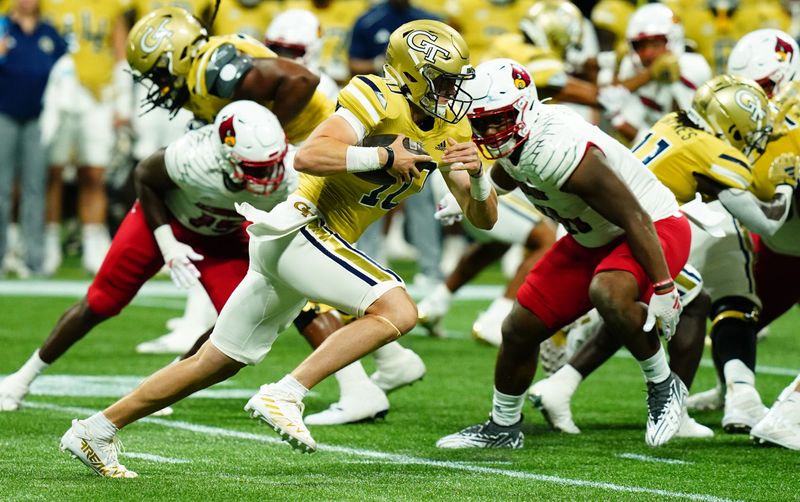 Sep 1, 2023; Atlanta, Georgia, USA; Georgia Tech Yellow Jackets quarterback Haynes King (10) scrambles up the field against the Louisville Cardinals during the first quarter at Mercedes-Benz Stadium. Mandatory Credit: John David Mercer-USA TODAY Sports