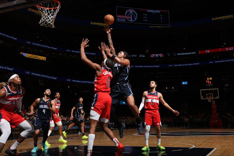 WASHINGTON, DC -? MARCH 6:  Paolo Banchero #5 of the Orlando Magic goes to the basket during the game on March 6, 2024 at Capital One Arena in Washington, DC. NOTE TO USER: User expressly acknowledges and agrees that, by downloading and or using this Photograph, user is consenting to the terms and conditions of the Getty Images License Agreement. Mandatory Copyright Notice: Copyright 2024 NBAE (Photo by Stephen Gosling/NBAE via Getty Images)