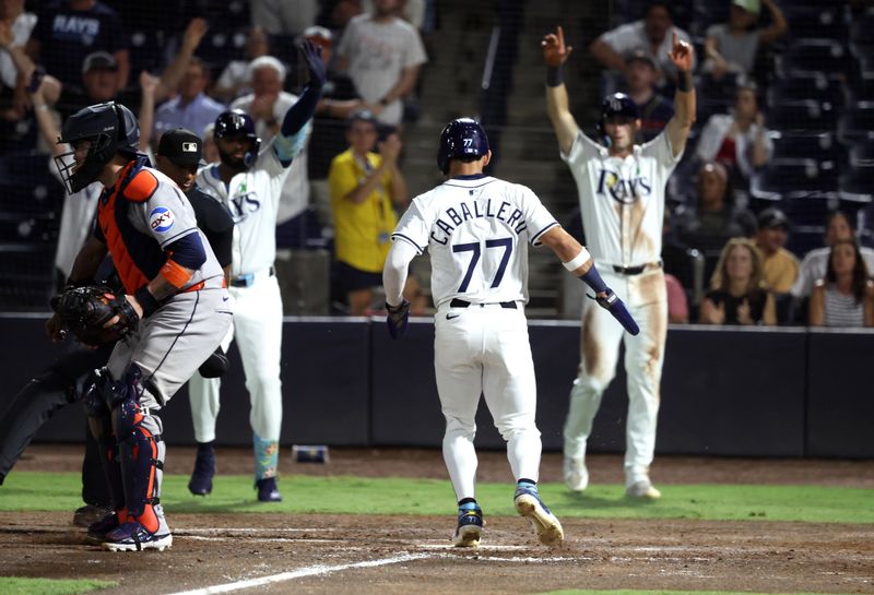 May 20, 2025; St. Petersburg, Florida, USA; Tampa Bay Rays outfielder Jose Caballero (77) scores a run during the eighth inning against the Houston Astros at George M. Steinbrenner Field. Mandatory Credit: Kim Klement Neitzel-Imagn Images