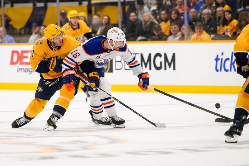 Oct 31, 2024; Nashville, Tennessee, USA;  Edmonton Oilers left wing Zach Hyman (18) and Nashville Predators defenseman Jeremy Lauzon (3) fight for the puck during the second period at Bridgestone Arena. Mandatory Credit: Steve Roberts-Imagn Images