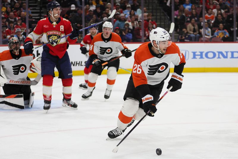 Feb 6, 2024; Sunrise, Florida, USA; Philadelphia Flyers defenseman Sean Walker (26) moves the puck against the Florida Panthers during the second period at Amerant Bank Arena. Mandatory Credit: Sam Navarro-USA TODAY Sports