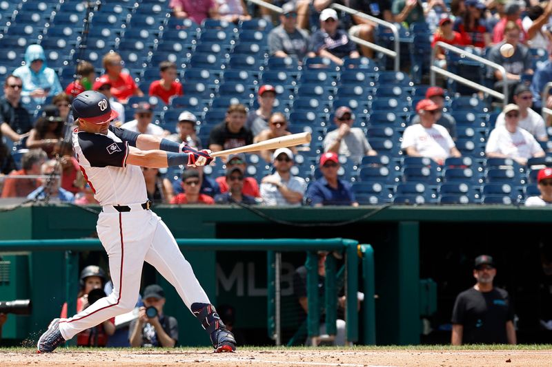 Jun 20, 2024; Washington, District of Columbia, USA;  Washington Nationals outfielder Lane Thomas (28) hits a solo home run against the Arizona Diamondbacks during the third inningat Nationals Park. Mandatory Credit: Geoff Burke-USA TODAY Sports