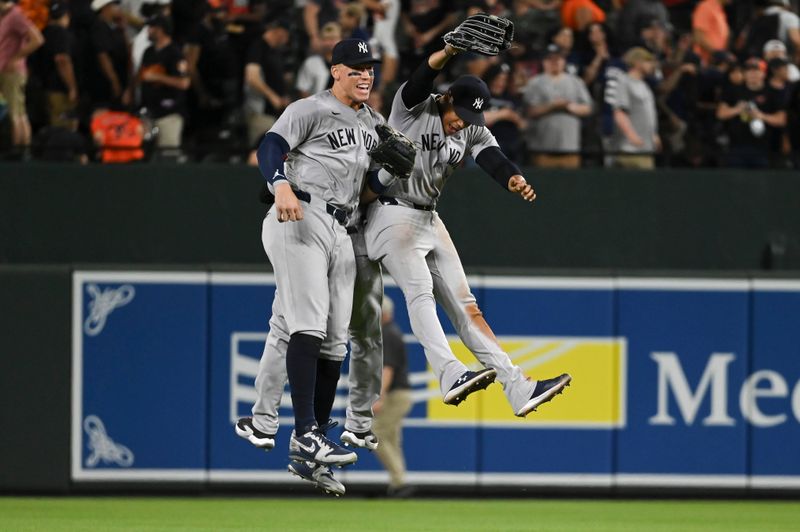 May 1, 2024; Baltimore, Maryland, USA;  New York Yankees outfielder Aaron Judge (99),outfielder Juan Soto (22) and  outfielder Trent Grisham (12) celebrate after the game against the Baltimore Orioles at Oriole Park at Camden Yards. Mandatory Credit: Tommy Gilligan-USA TODAY Sports