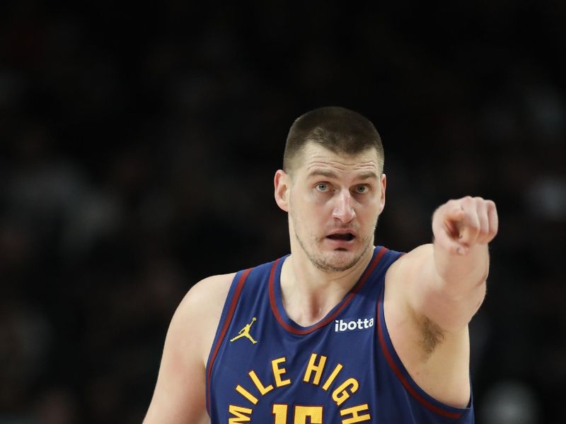 PORTLAND, OREGON - FEBRUARY 23: Nikola Jokic #15 of the Denver Nuggets reacts during the third quarter against the Portland Trail Blazers at Moda Center on February 23, 2024 in Portland, Oregon. NOTE TO USER: User expressly acknowledges and agrees that, by downloading and or using this photograph, User is consenting to the terms and conditions of the Getty Images License Agreement.? (Photo by Amanda Loman/Getty Images)