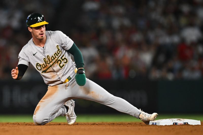 Jul 27, 2024; Anaheim, California, USA; Oakland Athletics designated hitter Brent Rooker (25) steals second base against the Los Angeles Angels during the eighth inning at Angel Stadium. Mandatory Credit: Jonathan Hui-USA TODAY Sports