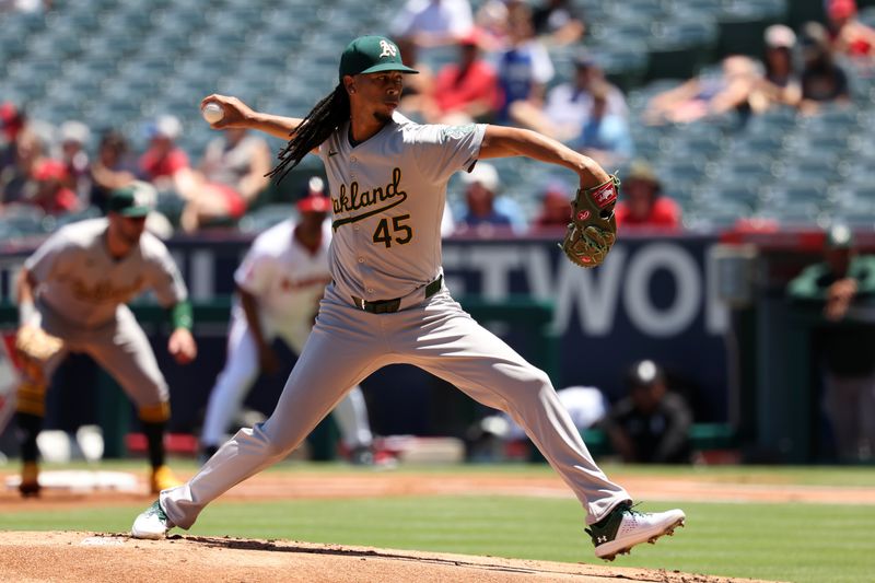 Jul 28, 2024; Anaheim, California, USA;  Oakland Athletics starting pitcher Osvaldo Bido (45) pitches during the first inning against the Los Angeles Angels at Angel Stadium. Mandatory Credit: Kiyoshi Mio-USA TODAY Sports