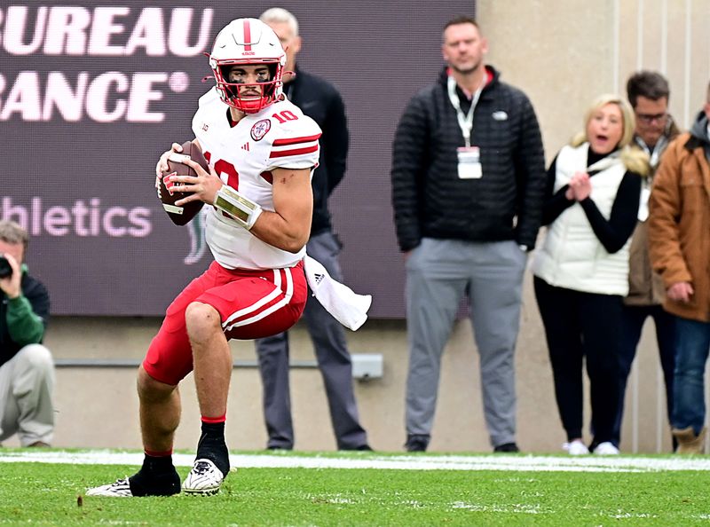 Nov 4, 2023; East Lansing, Michigan, USA; Nebraska Cornhuskers quarterback Heinrich Haarberg (10) looks for a receiver in the third quarter against the Michigan State Spartans at Spartan Stadium. Mandatory Credit: Dale Young-USA TODAY Sports