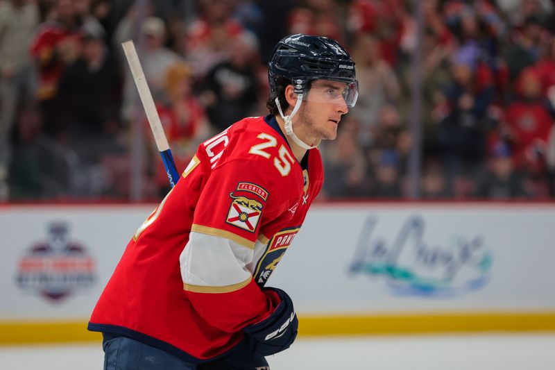 Nov 30, 2024; Sunrise, Florida, USA; Florida Panthers right wing Mackie Samoskevich (25) looks on after scoring against the Carolina Hurricanes during the second period at Amerant Bank Arena. Mandatory Credit: Sam Navarro-Imagn Images