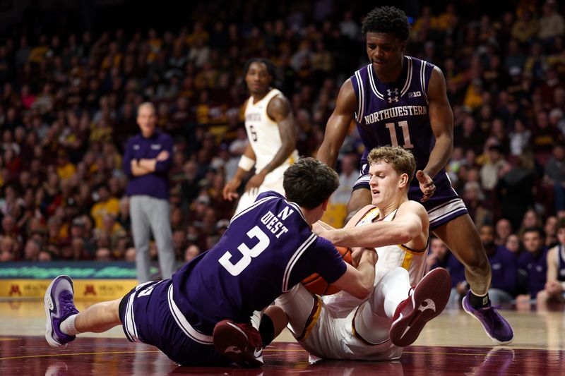Mar 7, 2026; Minneapolis, Minnesota, USA; Minnesota Golden Gophers forward Cade Tyson (10) and Northwestern Wildcats guard Jake West (3) compete for the ball during the first half at Williams Arena. Mandatory Credit: Matt Krohn-Imagn Images