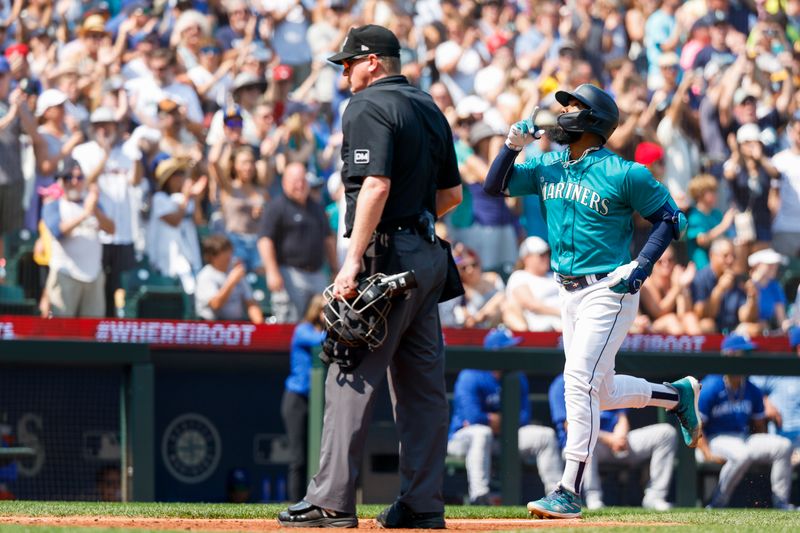 Aug 28, 2023; Seattle, Washington, USA; Seattle Mariners right fielder Teoscar Hernandez (35) runs the bases after hitting a grand slam home run against the Kansas City Royals during the third inning at T-Mobile Park. Mandatory Credit: Joe Nicholson-USA TODAY Sports