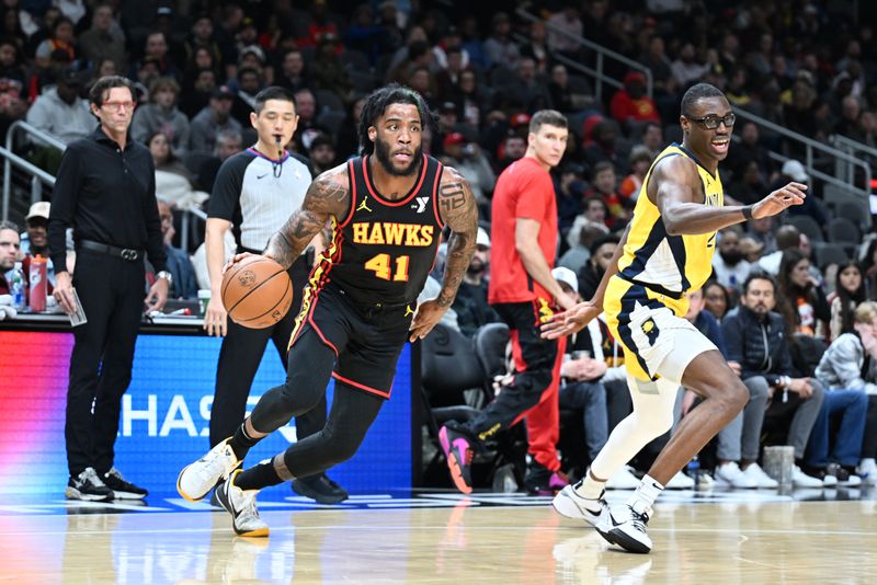 ATLANTA, GA - JANUARY 12: Saddiq Bey #41 of the Atlanta Hawks dribbles the ball during the game against the Indiana Pacers on January 12, 2024 at State Farm Arena in Atlanta, Georgia.  NOTE TO USER: User expressly acknowledges and agrees that, by downloading and/or using this Photograph, user is consenting to the terms and conditions of the Getty Images License Agreement. Mandatory Copyright Notice: Copyright 2024 NBAE (Photo by Adam Hagy/NBAE via Getty Images)