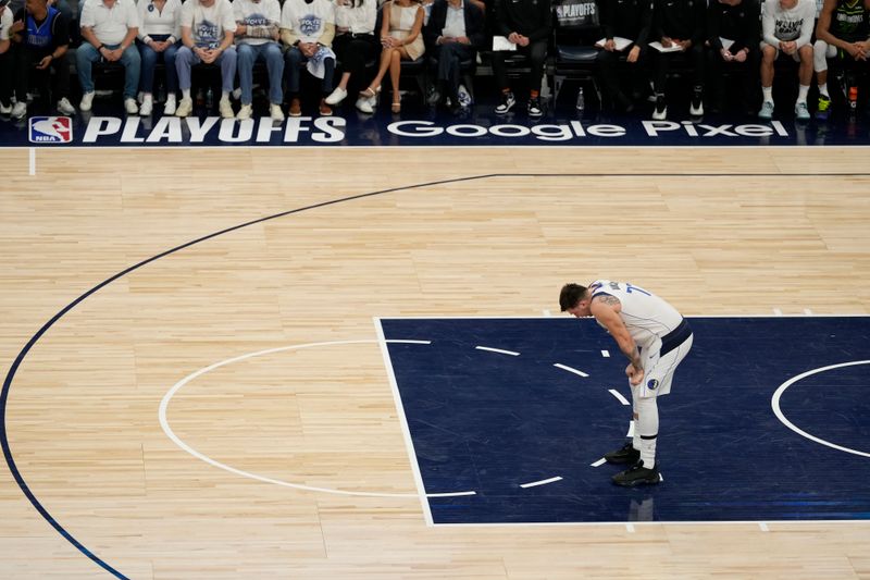 MINNEAPOLIS, MN - MAY 30: Luka Doncic #77 of the Dallas Mavericks looks on during the game against the Minnesota Timberwolves during Game 5 of the Western Conference Finals of the 2024 NBA Playoffs on May 30, 2024 at Target Center in Minneapolis, Minnesota. NOTE TO USER: User expressly acknowledges and agrees that, by downloading and or using this Photograph, user is consenting to the terms and conditions of the Getty Images License Agreement. Mandatory Copyright Notice: Copyright 2024 NBAE (Photo by Jordan Johnson/NBAE via Getty Images)