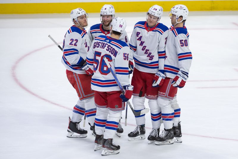 Jan 27, 2024; Ottawa, Ontario, CAN; The New York Rangers celebrate a goal scored by right wing Kaapo Kakko (24) in the third period against the Ottawa Senators at the Canadian Tire Centre. Mandatory Credit: Marc DesRosiers-USA TODAY Sports