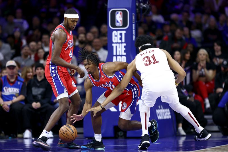 PHILADELPHIA, PENNSYLVANIA - FEBRUARY 23: Tyrese Maxey #0 of the Philadelphia 76ers steals the ball from Jarrett Allen #31 of the Cleveland Cavaliers during the first quarter at the Wells Fargo Center on February 23, 2024 in Philadelphia, Pennsylvania. (Photo by Tim Nwachukwu/Getty Images)