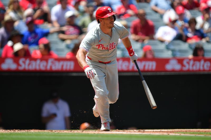 May 1, 2024; Anaheim, California, USA; Philadelphia Phillies catcher J.T. Realmuto (10) hits a single against the Los Angeles Angels during the second inning at Angel Stadium. Mandatory Credit: Gary A. Vasquez-USA TODAY Sports