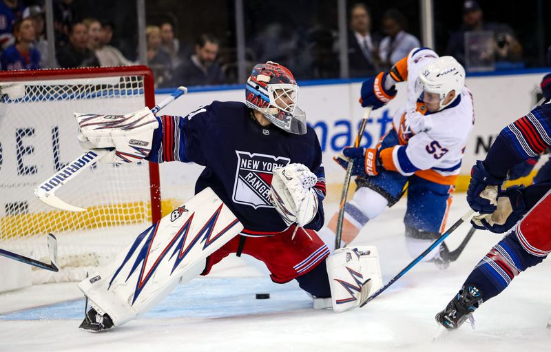 Nov 3, 2024; New York, New York, USA; New York Rangers goalie Igor Shesterkin (31) can’t stop a rebound goal from New York Islanders center Casey Cizikas (53) during the second period at Madison Square Garden. Mandatory Credit: Danny Wild-Imagn Images