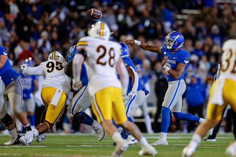 Oct 14, 2023; Colorado Springs, Colorado, USA; Air Force Falcons quarterback Zac Larrier (9) attempts a pass as Wyoming Cowboys linebacker Easton Gibbs (28) looks on in the fourth quarter at Falcon Stadium. Mandatory Credit: Isaiah J. Downing-USA TODAY Sports