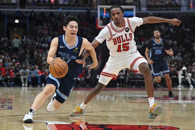 CHICAGO, ILLINOIS - OCTOBER 12: Yuki Kawamura #17 of the Memphis Grizzlies drives in the second half of a preseason game against Julian Phillips #15 of the Chicago Bulls at the United Center on October 12, 2024 in Chicago, Illinois. NOTE TO USER: User expressly acknowledges and agrees that, by downloading and or using this photograph, User is consenting to the terms and conditions of the Getty Images License Agreement. (Photo by Quinn Harris/Getty Images)