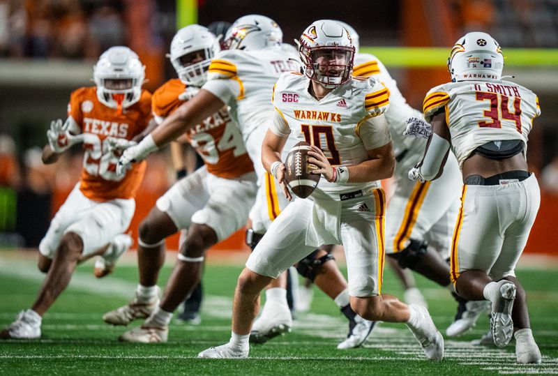 Sep 21, 2024; Austin, Texas, USA; Louisiana Monroe Warhawks quarterback Aidan Armenta (10) turns around looking for a pass in the second half of the Longhorns' game against the ULM Warhawks at Darrell K Royal Texas Memorial Stadium. Mandatory Credit: Sara Diggins-Imagn Images