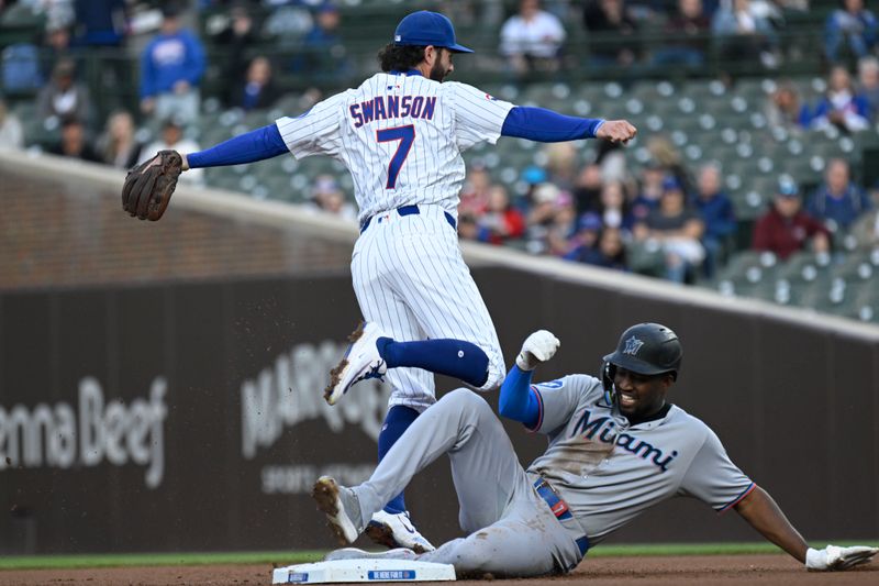 May 12, 2025; Chicago, Illinois, USA;  Chicago Cubs shortstop Dansby Swanson (7) throws to first for a double play after forcing Miami Marlins outfielder Jesús Sánchez (7) out during the first inning at Wrigley Field. Mandatory Credit: Matt Marton-Imagn Images
