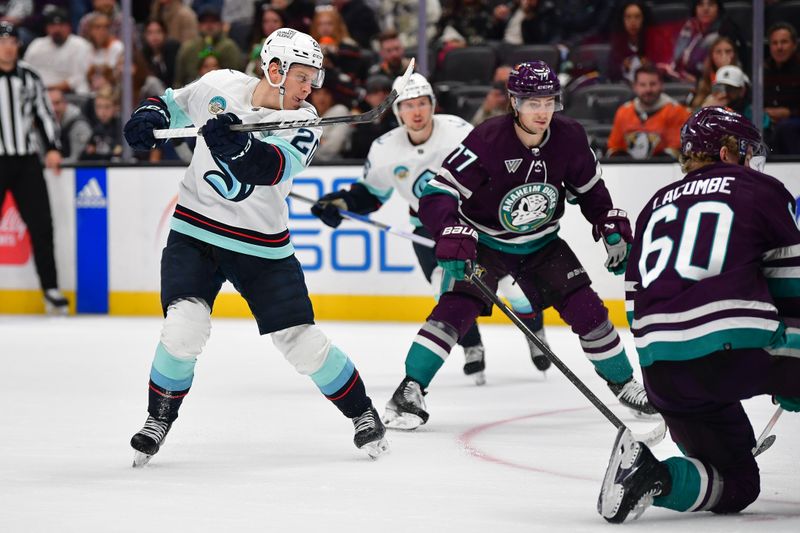 Dec 23, 2023; Anaheim, California, USA; Seattle Kraken right wing Eeli Tolvanen (20) shoots on goal against Anaheim Ducks defenseman Jackson LaCombe (60) during the third period at Honda Center. Mandatory Credit: Gary A. Vasquez-USA TODAY Sports